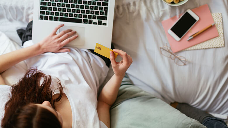 woman shopping online-laptop-credit card